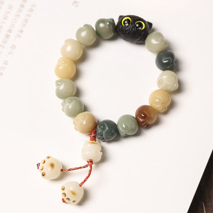 Pulsera de la suerte con forma de gato de la sabiduría y semillas de Bodhi naturales de Mythstone con forma de pata encantadora de madera de ébano 