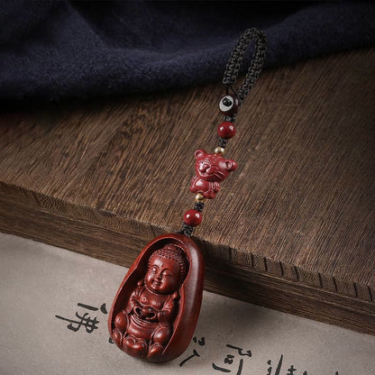 Llavero con amuleto de protección del zodíaco chino con forma de Buda de cinabrio y sándalo rojo y hoja pequeña de piedra mitológica