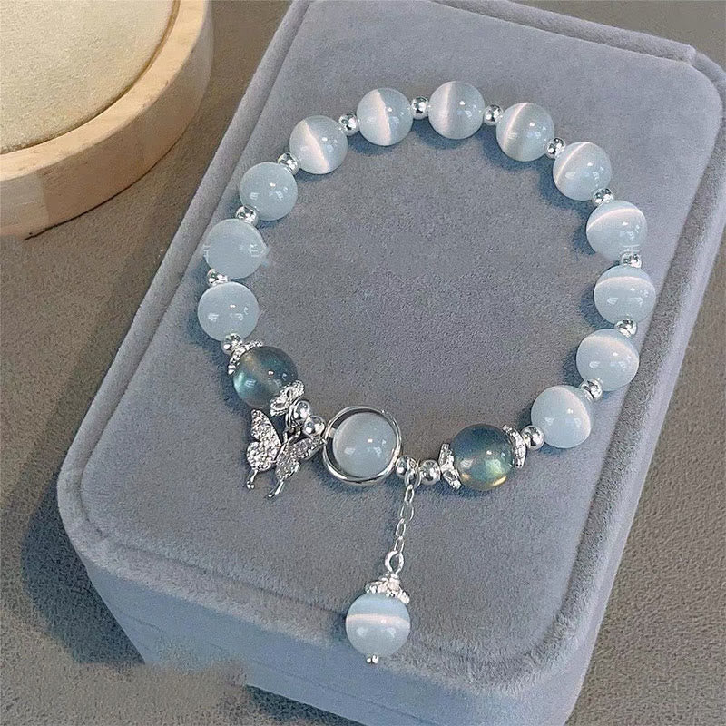 Pulsera de soporte con dije de estrella y mariposa con piedra lunar y ojo de gato de Mythstone