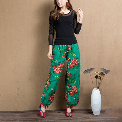 Pantalones harén con estampado de flores rojas y verdes de estilo étnico Mythstone y bolsillos 