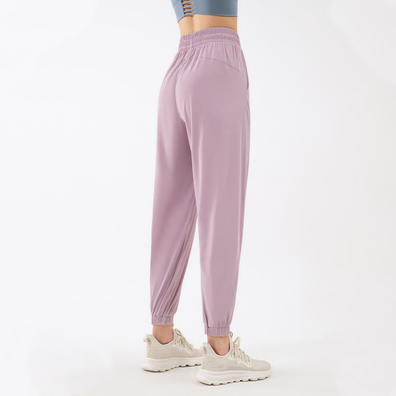 Pantalones deportivos de yoga holgados de color liso con bolsillos Mythstone 