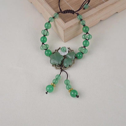 Pulsera de jade verde natural con flor colgante y suerte de Mythstone