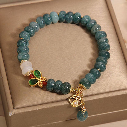 Pulsera de la abundancia con cuentas de ábaco en forma de mariposa y ágata blanca de jade Mythstone 