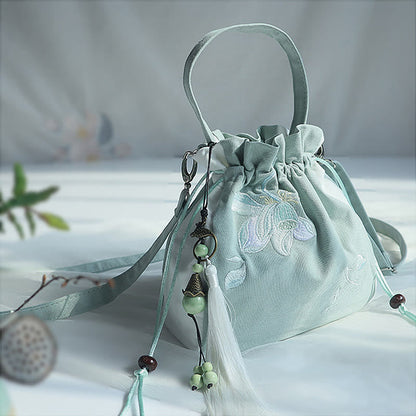 Bolso de mano de lona con flores bordadas a mano de Mythstone