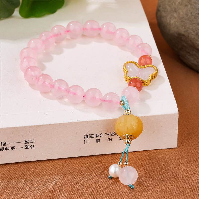 Pulsera de amor con forma de calabaza y mariposa de cristal rosa natural Mythstone 