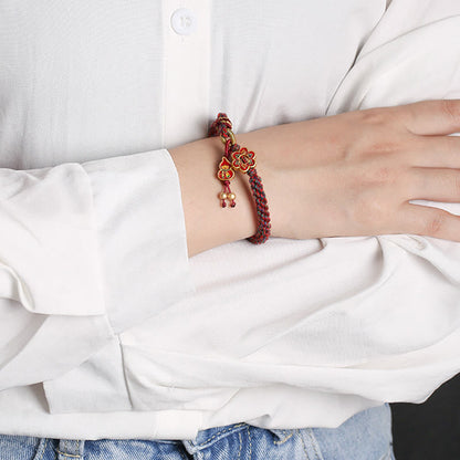 Pulsera trenzada de protección con flores de calabaza de colores hecha a mano de Mythstone