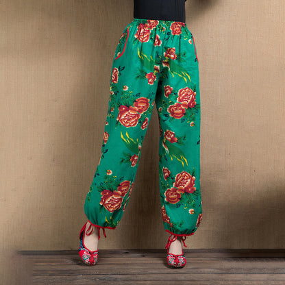 Pantalones harén con estampado de flores rojas y verdes de estilo étnico Mythstone y bolsillos 