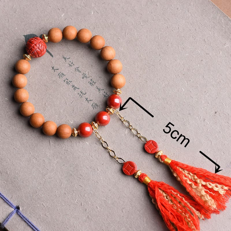 Pulsera de borlas de riqueza PiXiu con cinabrio de madera de melocotón natural tibetano Mythstone 