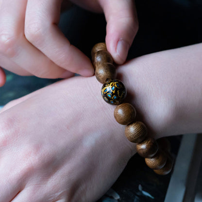 Mythstone Tarakan Agarwood Amber Red Agate Laughing Buddha Strength Meditation Bracelet