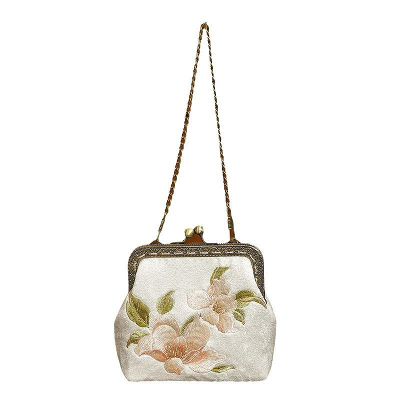 Bolso de mano con asa de metal y bordado de mariposas con orquídeas orientales Mythstone 