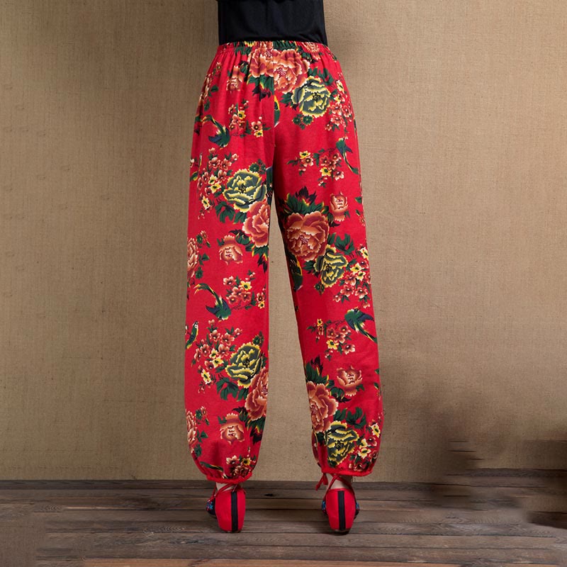 Pantalones harén con estampado de flores rojas y verdes de estilo étnico Mythstone y bolsillos 