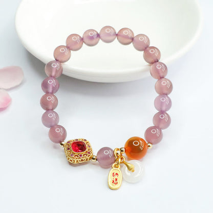 Pulsera con amuleto de la suerte y la armonía con hebilla de paz y ágata de caramelo de calcedonia morada natural Mythstone