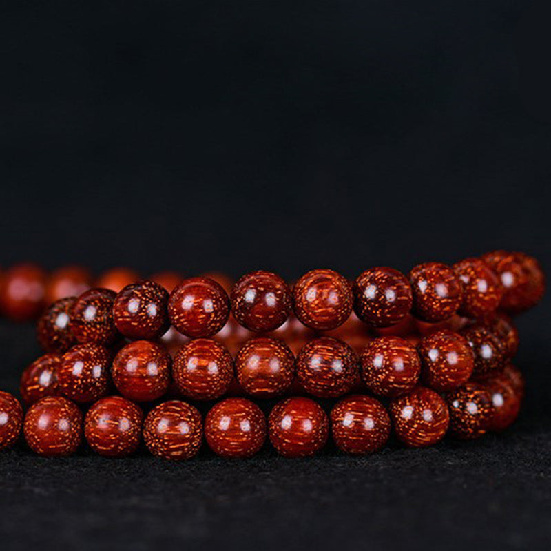 Pulsera de equilibrio de sándalo rojo con hojas pequeñas tibetanas de MythStone 