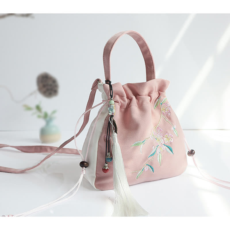 Bolso de mano de lona con flores bordadas a mano de Mythstone