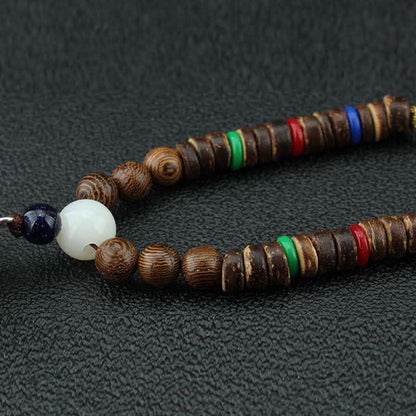 Collar con colgante de madera Vajra con rueda de oración tibetana Om Mani Padme Hum de Mythstone