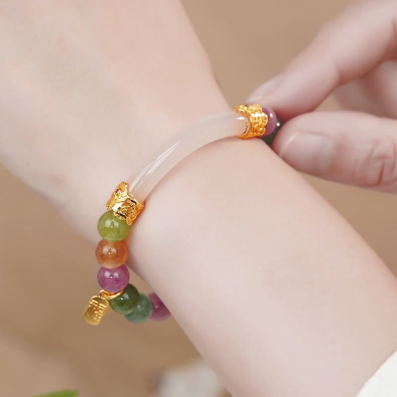 Pulsera con dijes de turmalina y calcedonia de colores Mythstone con carácter positivo Fu