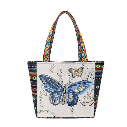 Bolso de mano de lona de gran capacidad con bordado de mariposa y elefante de Mythstone