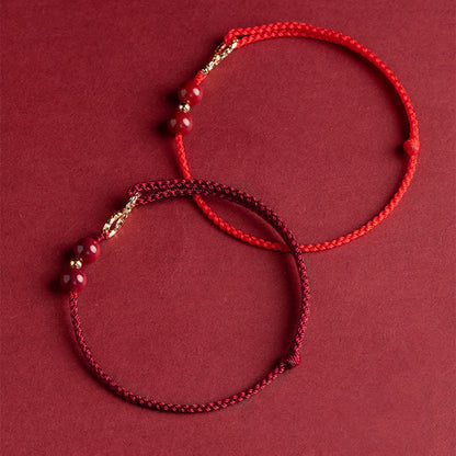 Pulsera tobillera con símbolo del infinito en oro de 14 quilates y hilo rojo con bendición de cinabrio de MythStone