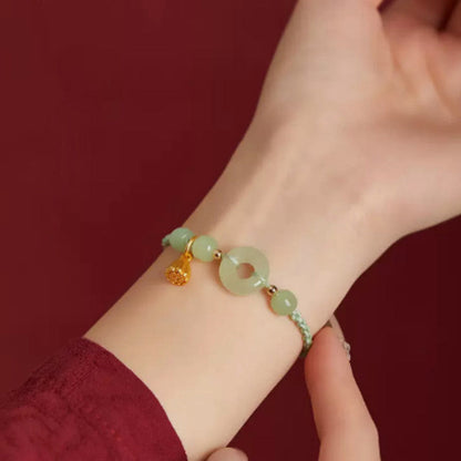 Pulsera de hilo con hebilla de paz redonda de piedra mitológica con loto de jade, felicidad, abundancia y riqueza