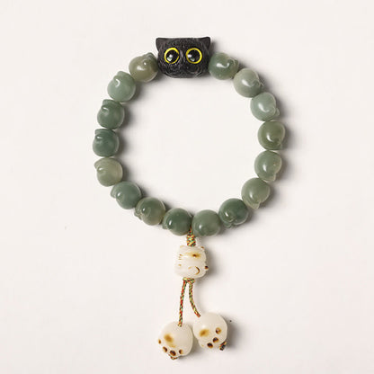 Pulsera de la suerte con forma de gato de la sabiduría y semillas de Bodhi naturales de Mythstone con forma de pata encantadora de madera de ébano 