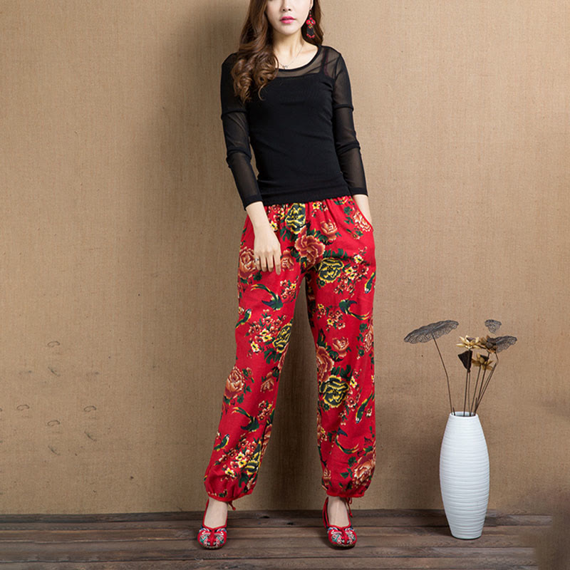 Pantalones harén con estampado de flores rojas y verdes de estilo étnico Mythstone y bolsillos 