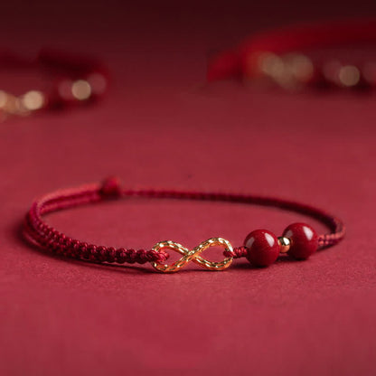 Pulsera tobillera con símbolo del infinito en oro de 14 quilates y hilo rojo con bendición de cinabrio de MythStone