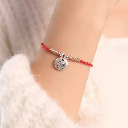 Pulsera trenzada con el signo de la suerte del año del dragón chino hecha a mano en plata de ley 999 de Mythstone 