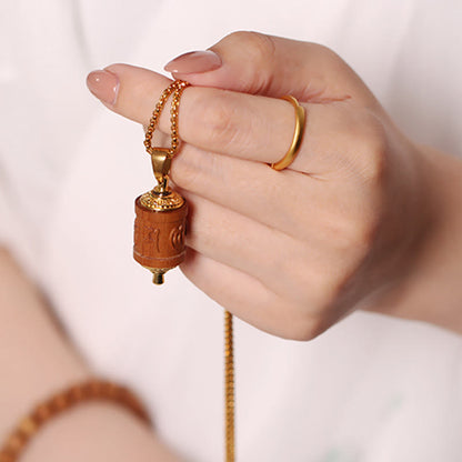 Collar con colgante de rueda de oración de sándalo tibetano Mythstone Om Mani Padme Hum para alejar los malos espíritus