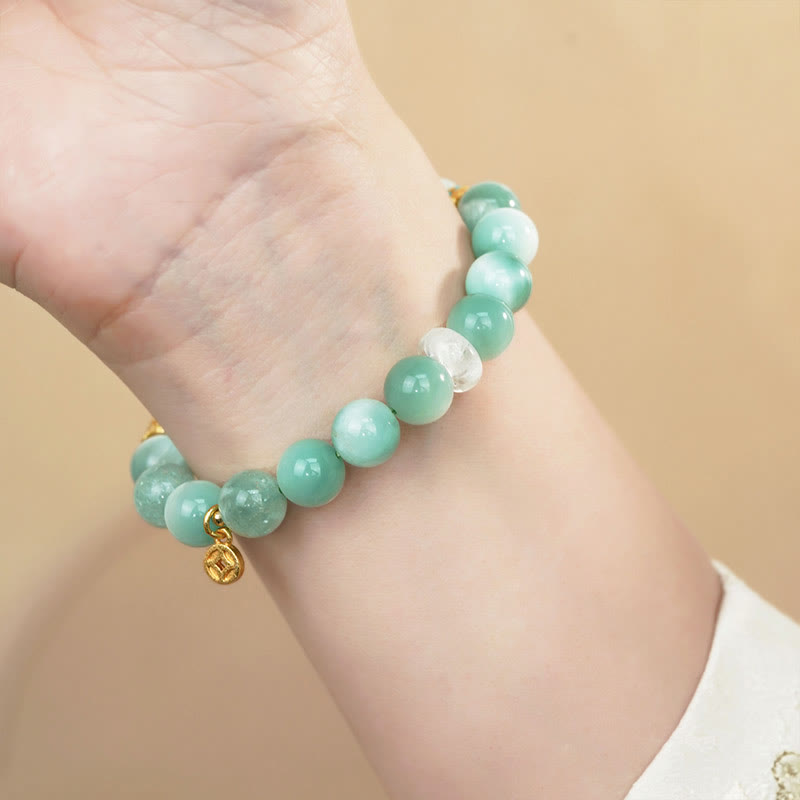 Pulsera de confianza con moneda de cobre y larimar natural Mythstone 