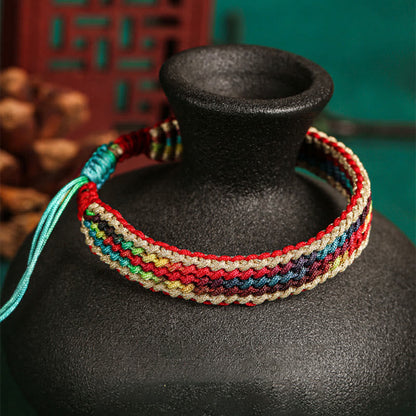 Pulsera trenzada de protección multicolor hecha a mano con piedra mítica del Tíbet