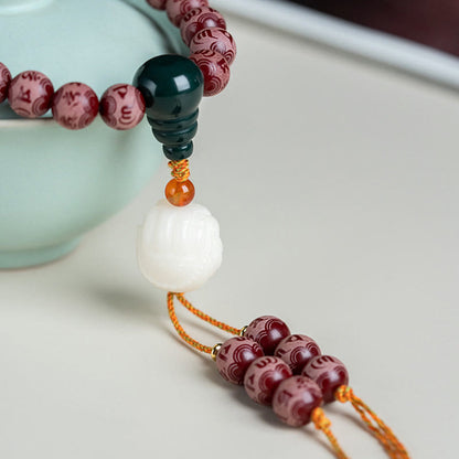 Pulsera de armonía grabada con semilla de bodhi roja de Mythstone Om Mani Padme Hum Lotus 