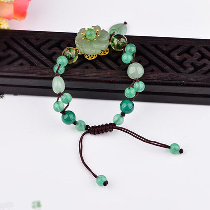 Pulsera de jade verde natural con flor colgante y suerte de Mythstone