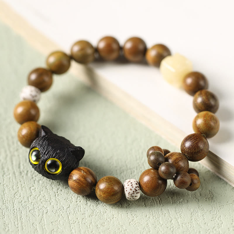 Pulsera relajante de madera de ébano y sándalo verde con diseño de gato y piedra mitológica 