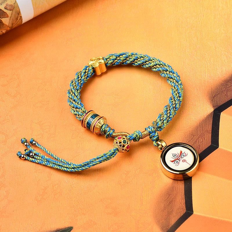 Pulsera de hilo tejido con amuleto Thangka de los cinco dioses de la riqueza y la suerte hecha a mano con forma de rueda de oración y flores de Mythstone Tibet