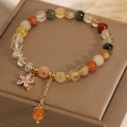 Pulsera de cuarzo rutilado multicolor con circonitas auspiciosas y flor de Mythstone