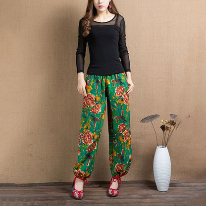 Pantalones harén con estampado de flores rojas y verdes de estilo étnico Mythstone y bolsillos 