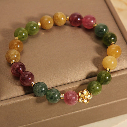 Pulsera positiva con flor dorada y turmalina natural de colores Mythstone