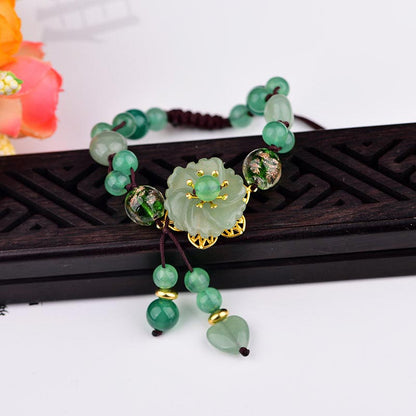 Pulsera de jade verde natural con flor colgante y suerte de Mythstone