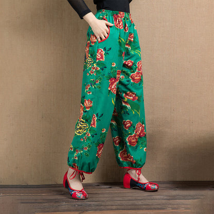 Pantalones harén con estampado de flores rojas y verdes de estilo étnico Mythstone y bolsillos 