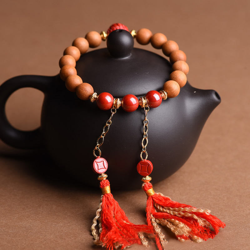 Pulsera de borlas de riqueza PiXiu con cinabrio de madera de melocotón natural tibetano Mythstone 