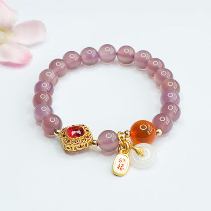 Pulsera con amuleto de la suerte y la armonía con hebilla de paz y ágata de caramelo de calcedonia morada natural Mythstone