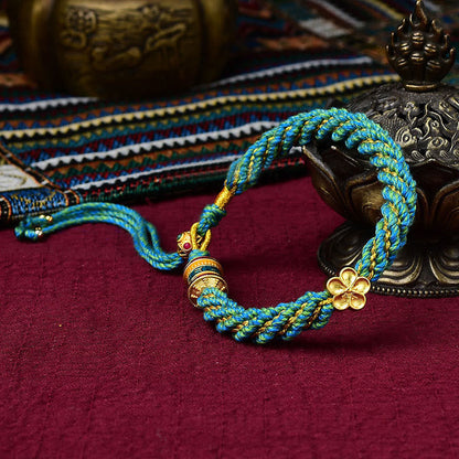 Pulsera de hilo tejido con amuleto Thangka de los cinco dioses de la riqueza y la suerte hecha a mano con forma de rueda de oración y flores de Mythstone Tibet