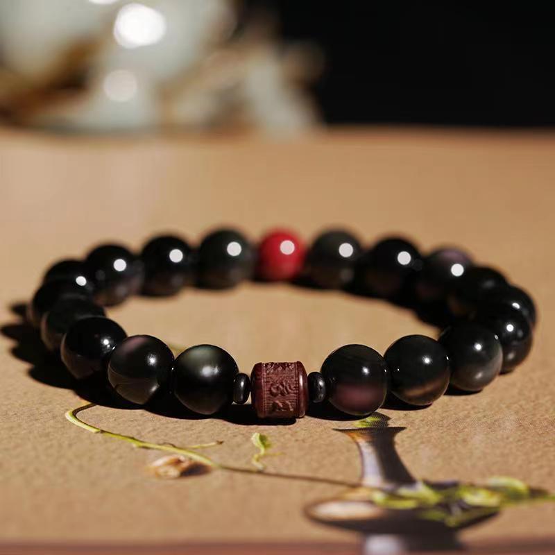 Pulsera curativa con personaje Om Mani Padme Hum Fu y obsidiana arcoíris con brillo dorado natural de Mythstone 