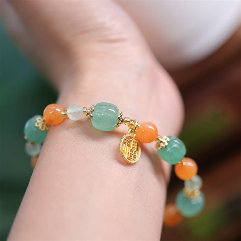 Pulsera de la riqueza con abalorios de calabaza de jade y seda dorada natural de Mythstone 