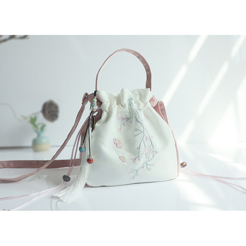 Bolso de mano de lona con flores bordadas a mano de Mythstone