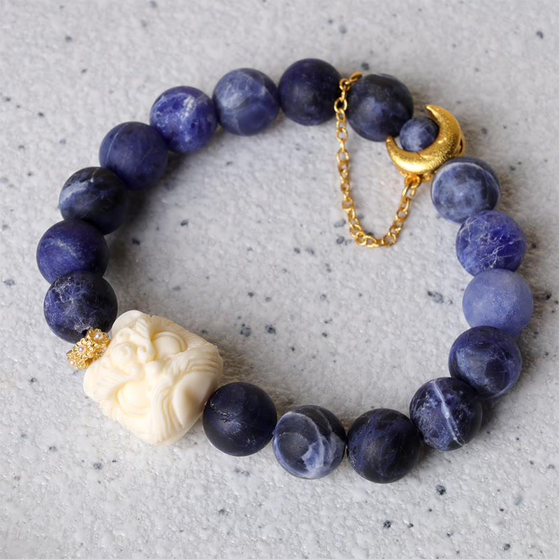 Pulsera de armonía con luna creciente y león danzante de marfil, sodalita y piedra mitológica