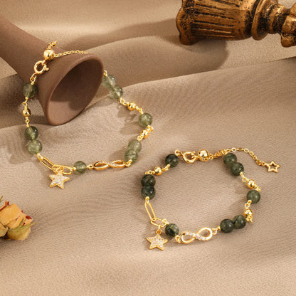 Pulsera de protección con estrellas del amor eterno y cuarzo rutilado verde en oro de 14 quilates de Mythstone con lazo Möbius 