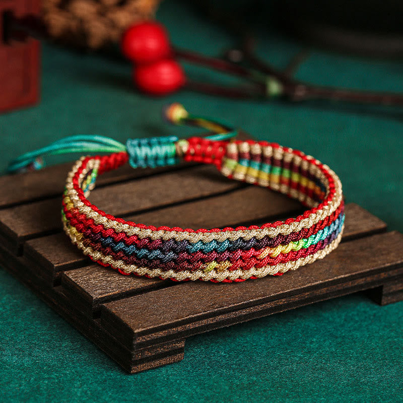 Pulsera trenzada de protección multicolor hecha a mano con piedra mítica del Tíbet