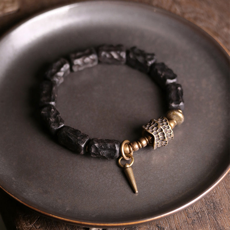 Pulsera de pareja con protección del equilibrio de cobre y madera de ébano Mythstone