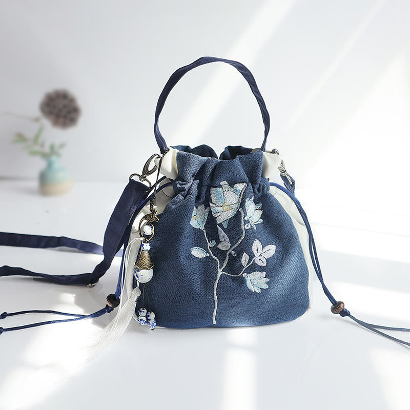 Bolso de mano de lona con flores bordadas a mano de Mythstone